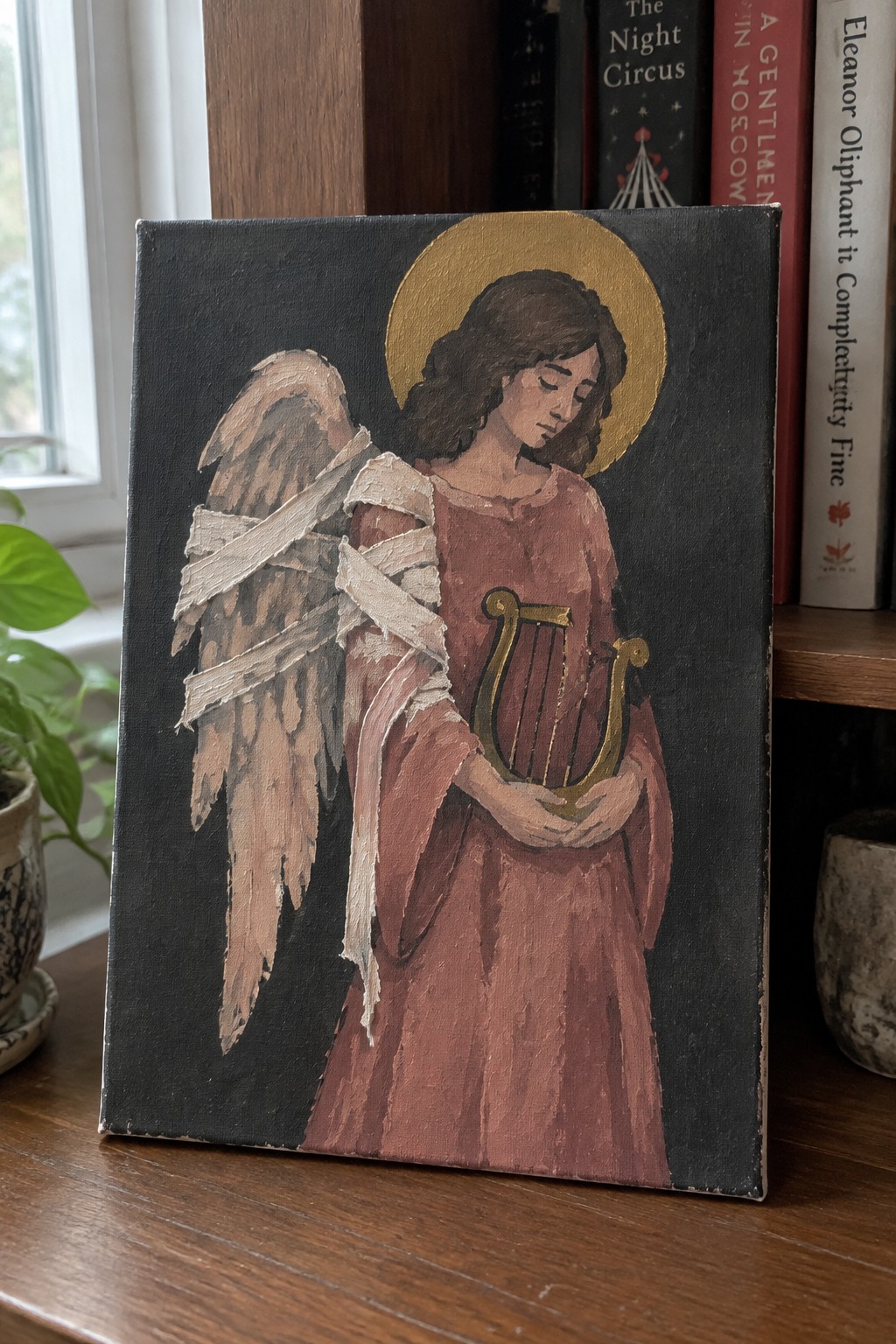 Angel with bandaged wings holding golden harp in red robe against dark background.