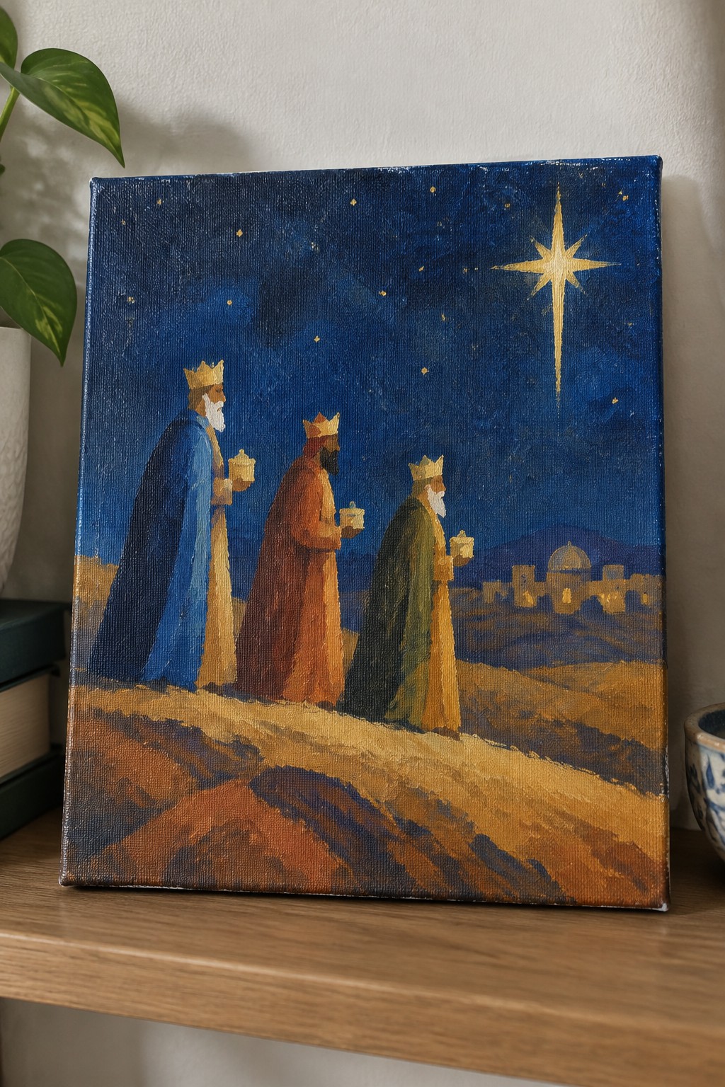 Three crowned kings in blue, orange, and green robes carry gifts under a bright star.