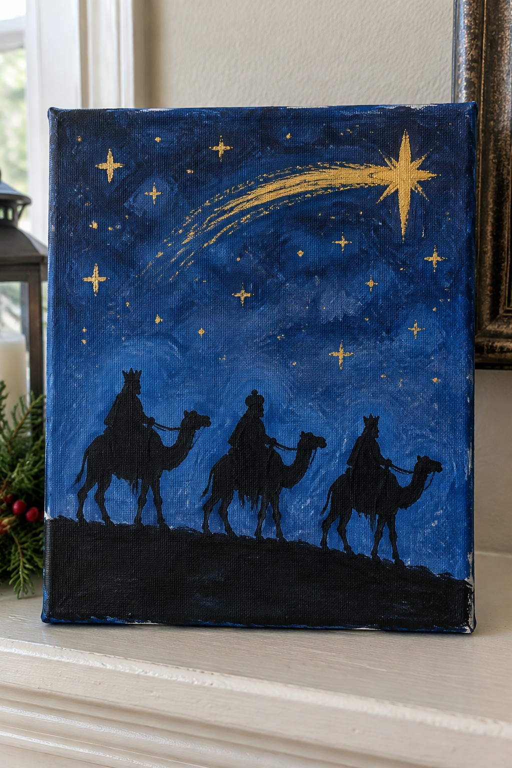 Three crowned silhouettes on camels under a golden comet in a starry blue sky painting.