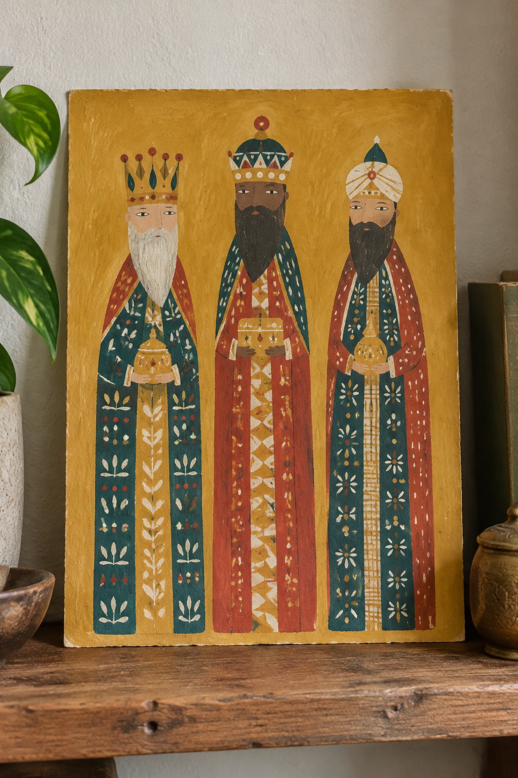 Folk-art painting of three bearded kings in ornate robes holding gifts on yellow background