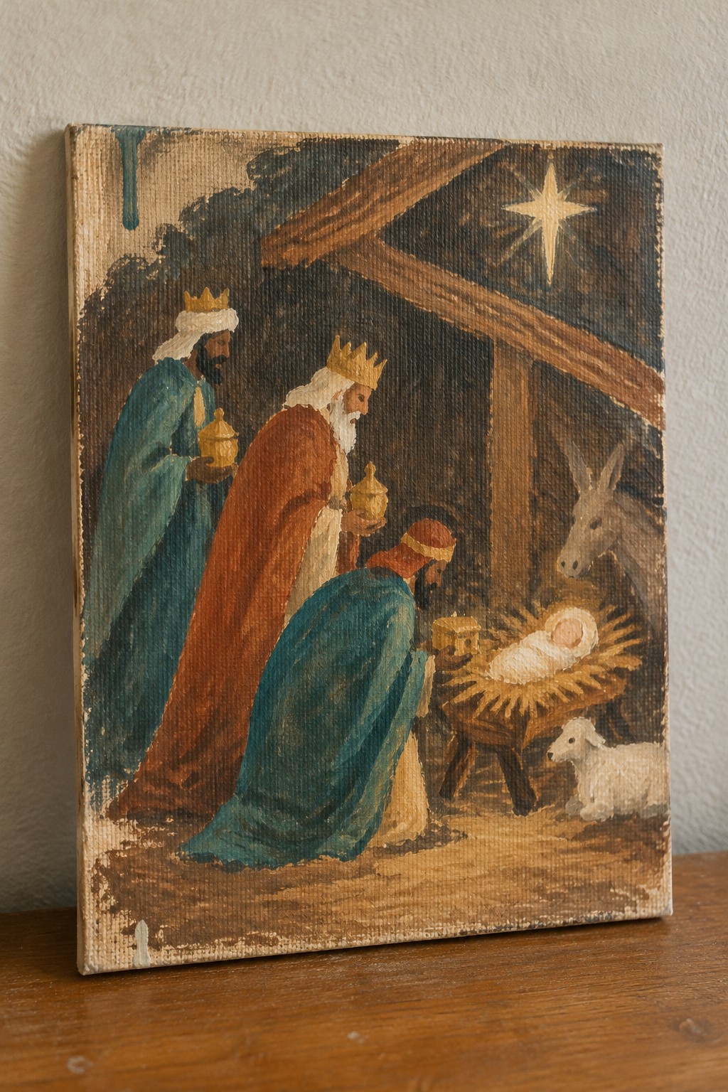 Three kings in blue, red, and teal robes offer gifts to newborn Jesus in manger.