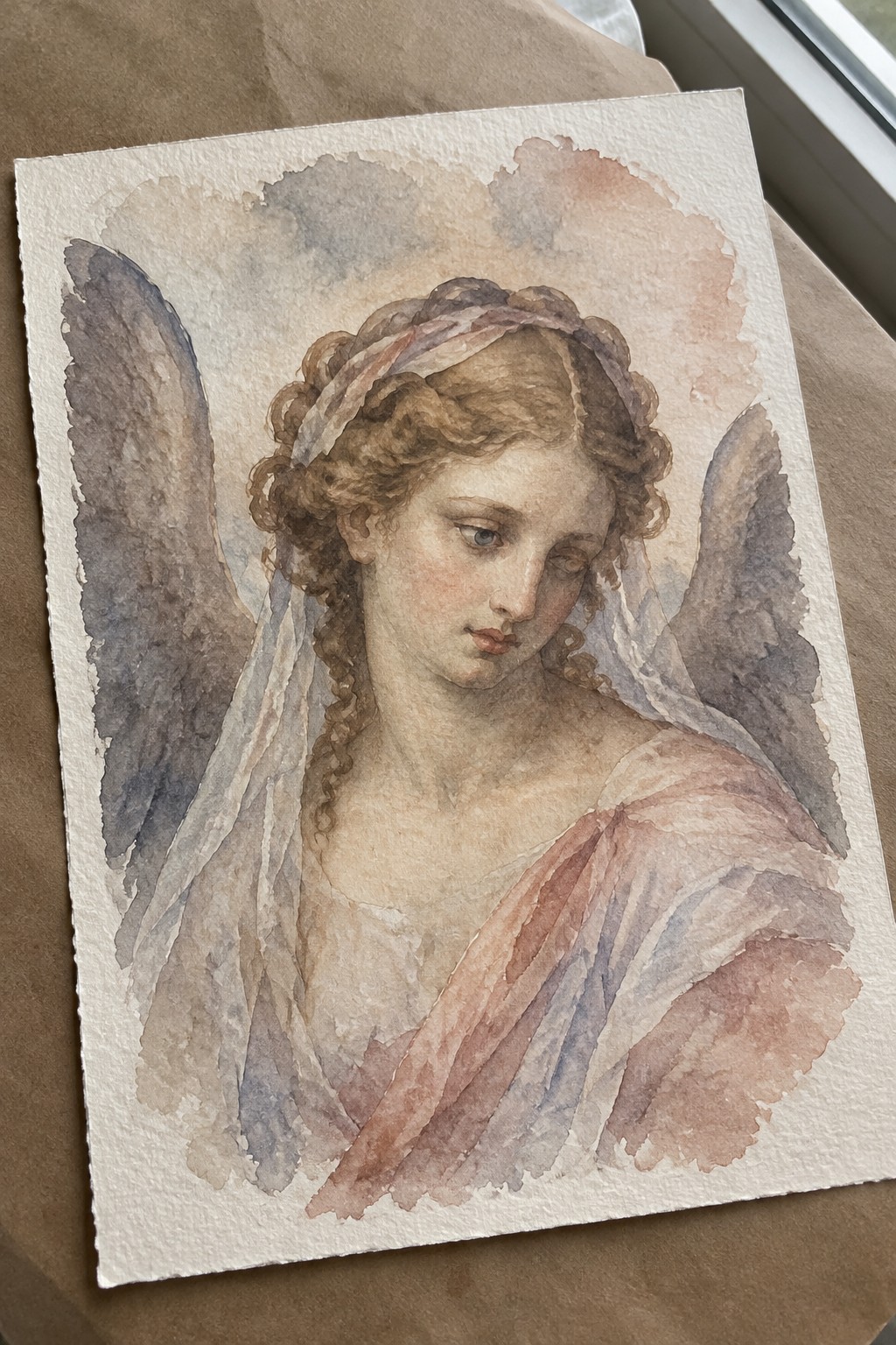 Watercolor angel with curly hair, wings, veil, and flowing robes in soft tones