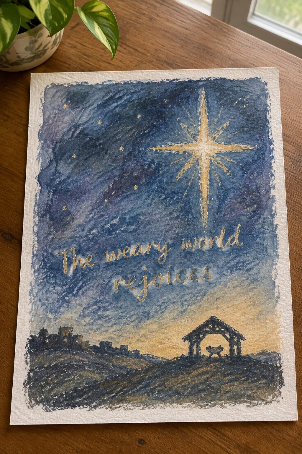 Watercolor nativity scene with golden star over stable and text 