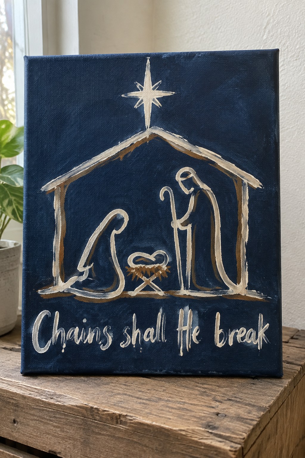 Dark blue canvas nativity painting with white figures, star, and 