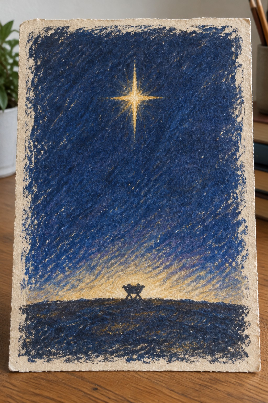 Golden star glowing above black manger in dark blue textured sky