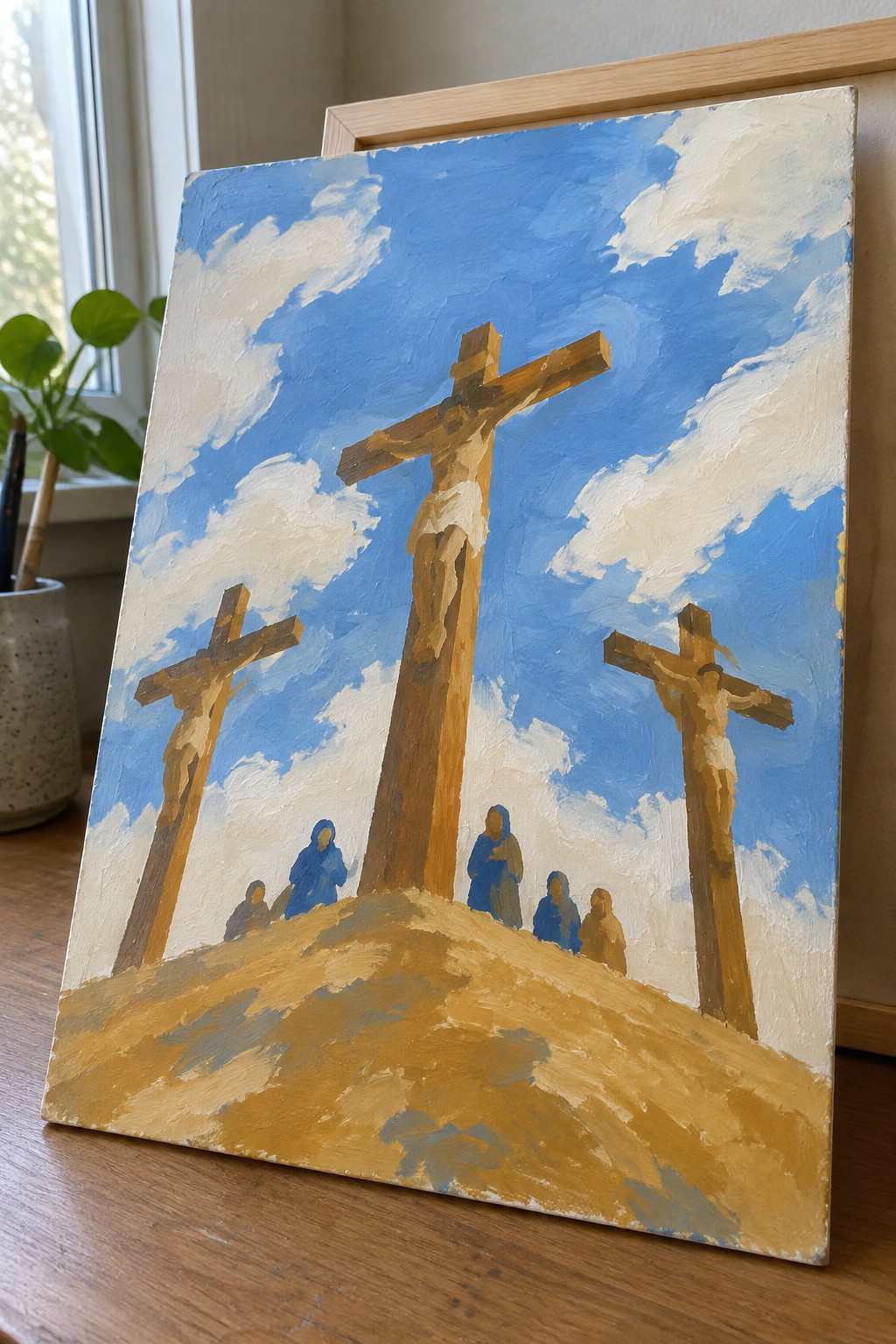 Oil painting of three crucifixions on a hill with robed figures under blue cloudy sky
