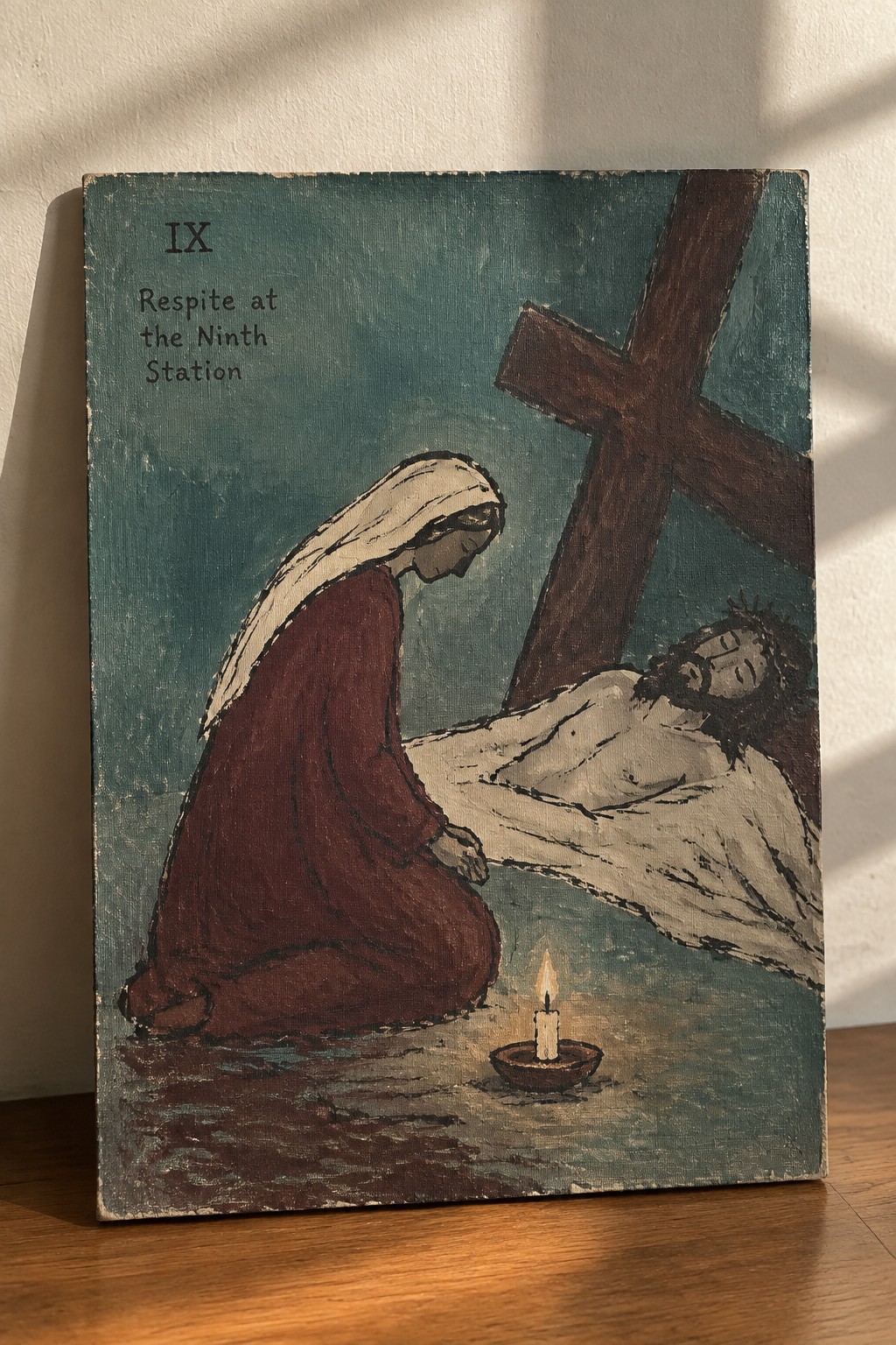 Kneeling woman in red robe beside Jesus' body, wooden cross, and lit candle on teal background.