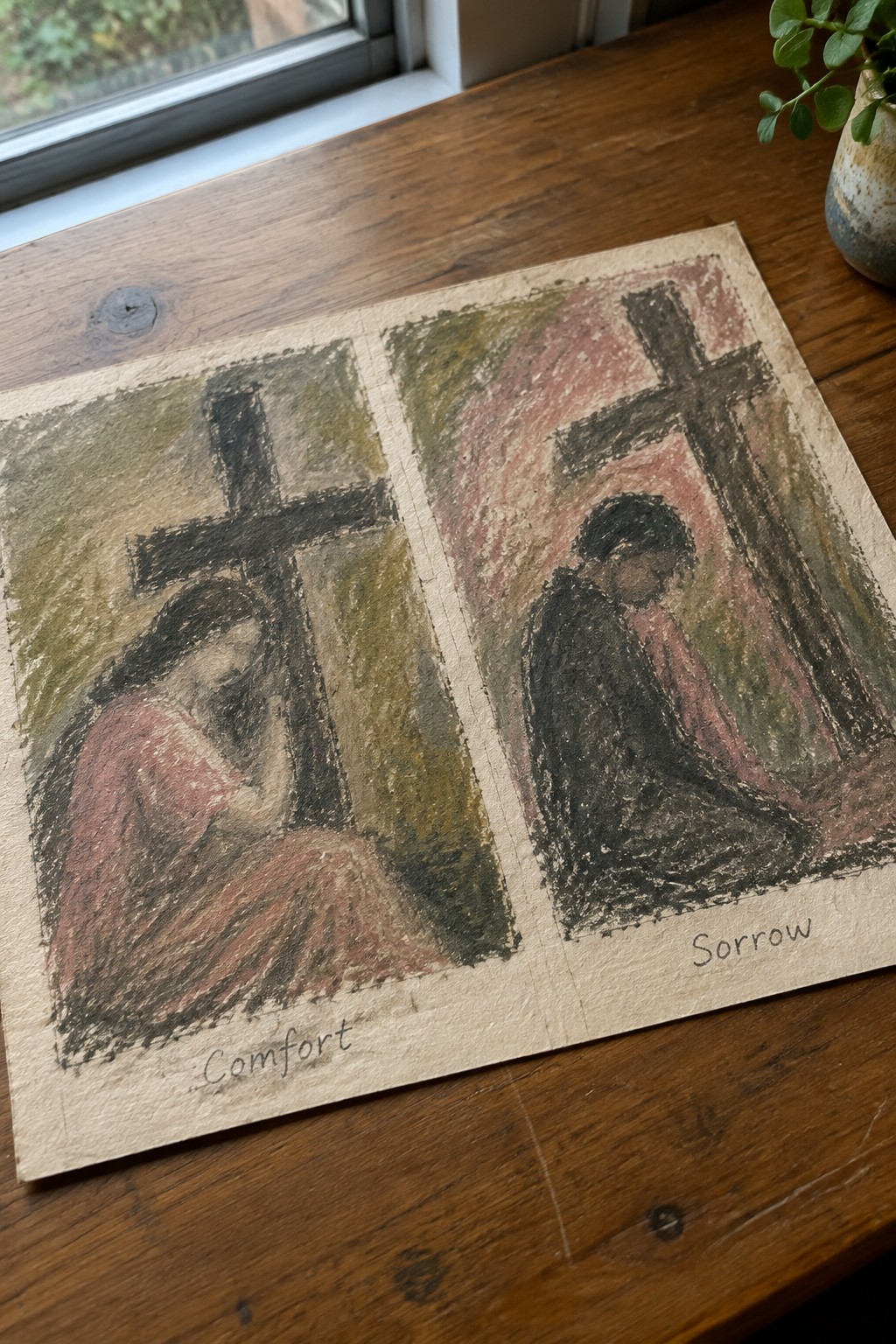 Pastel diptych on paper: robed figures bowed before black crosses, labeled Comfort and Sorrow.