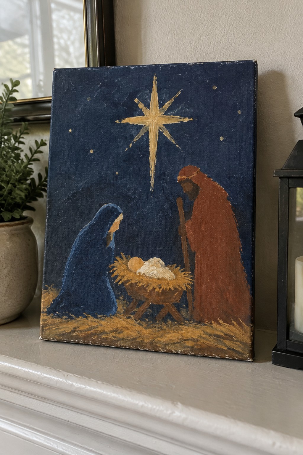 Nativity painting: blue-robed Mary, red-robed Joseph with staff, infant in manger under golden star.