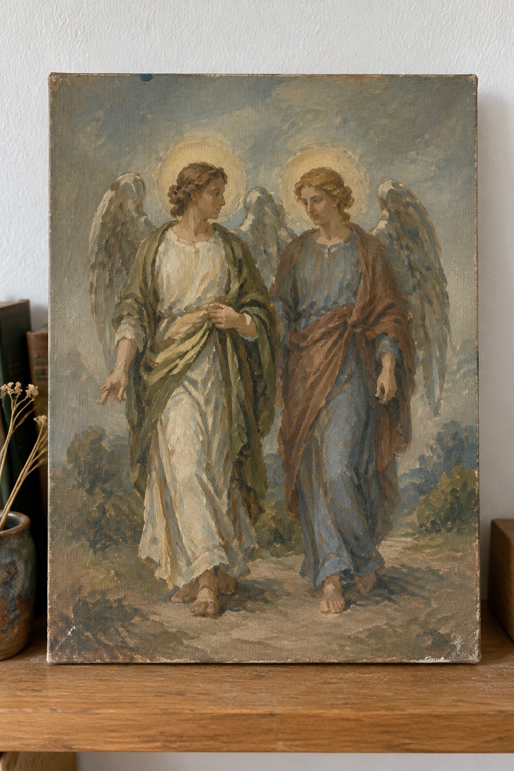 Two haloed angels with wings in flowing robes walk a rural dirt path in oil painting.