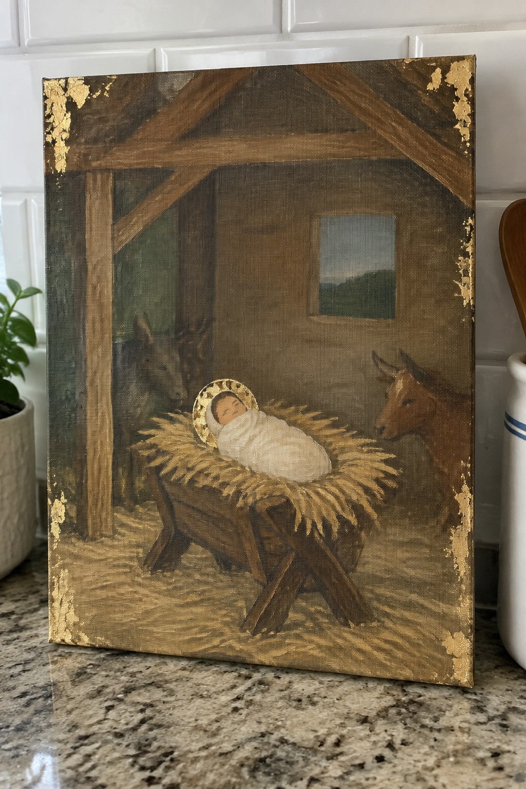 Nativity painting of swaddled baby with golden halo in hay manger beside donkey and cow
