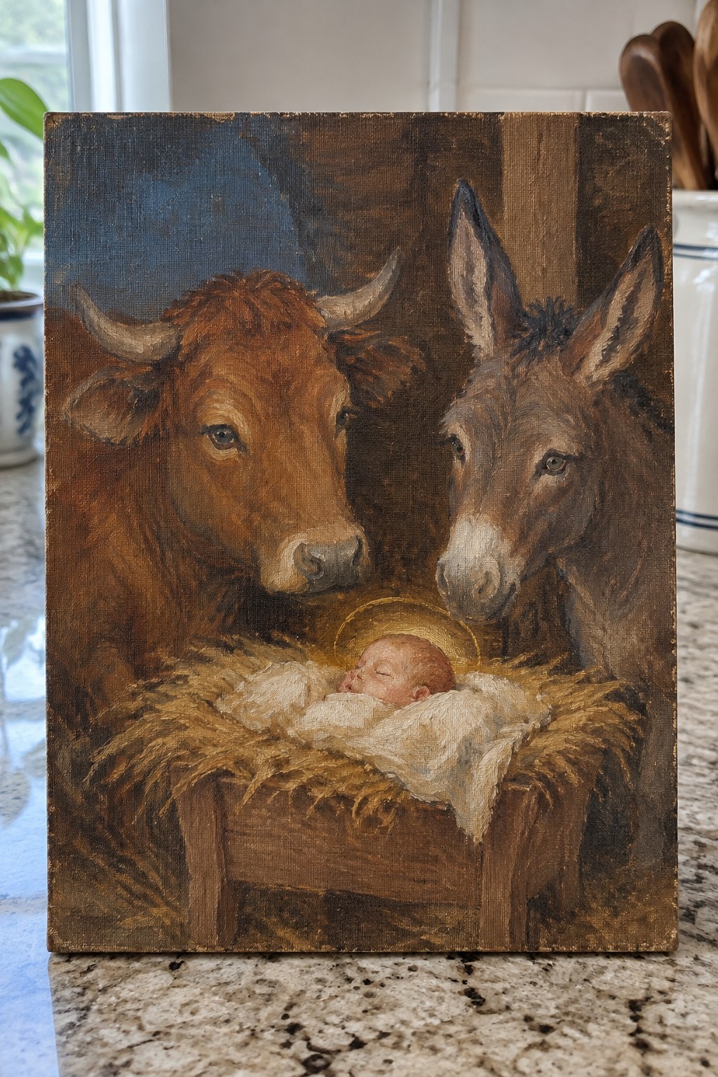 Painting of brown cow and donkey gazing at haloed baby in hay-filled manger.